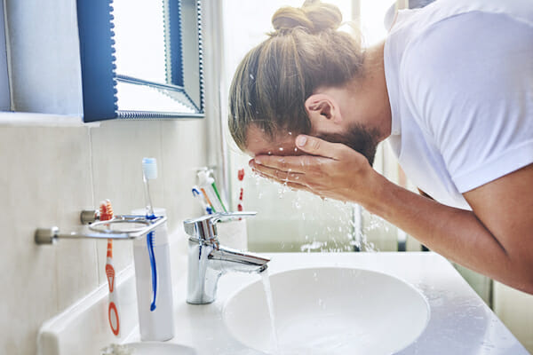Daily face washing showing how minerals in hard water affect skin