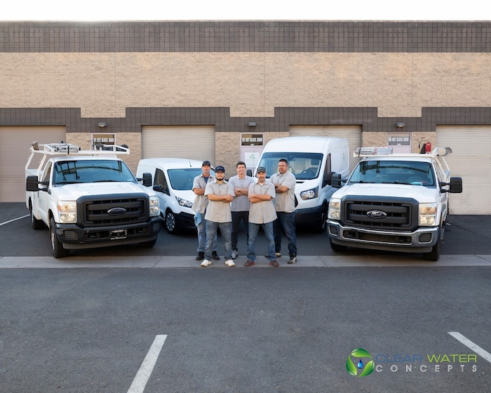 Clear Water Concepts team standing in front of service vehicles in Arizona