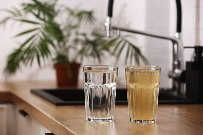 Comparison of clean filtered water and dirty untreated water, highlighting the importance of water filtration and purification systems