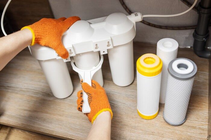 Routine maintenance for a home reverse osmosis water filtration system