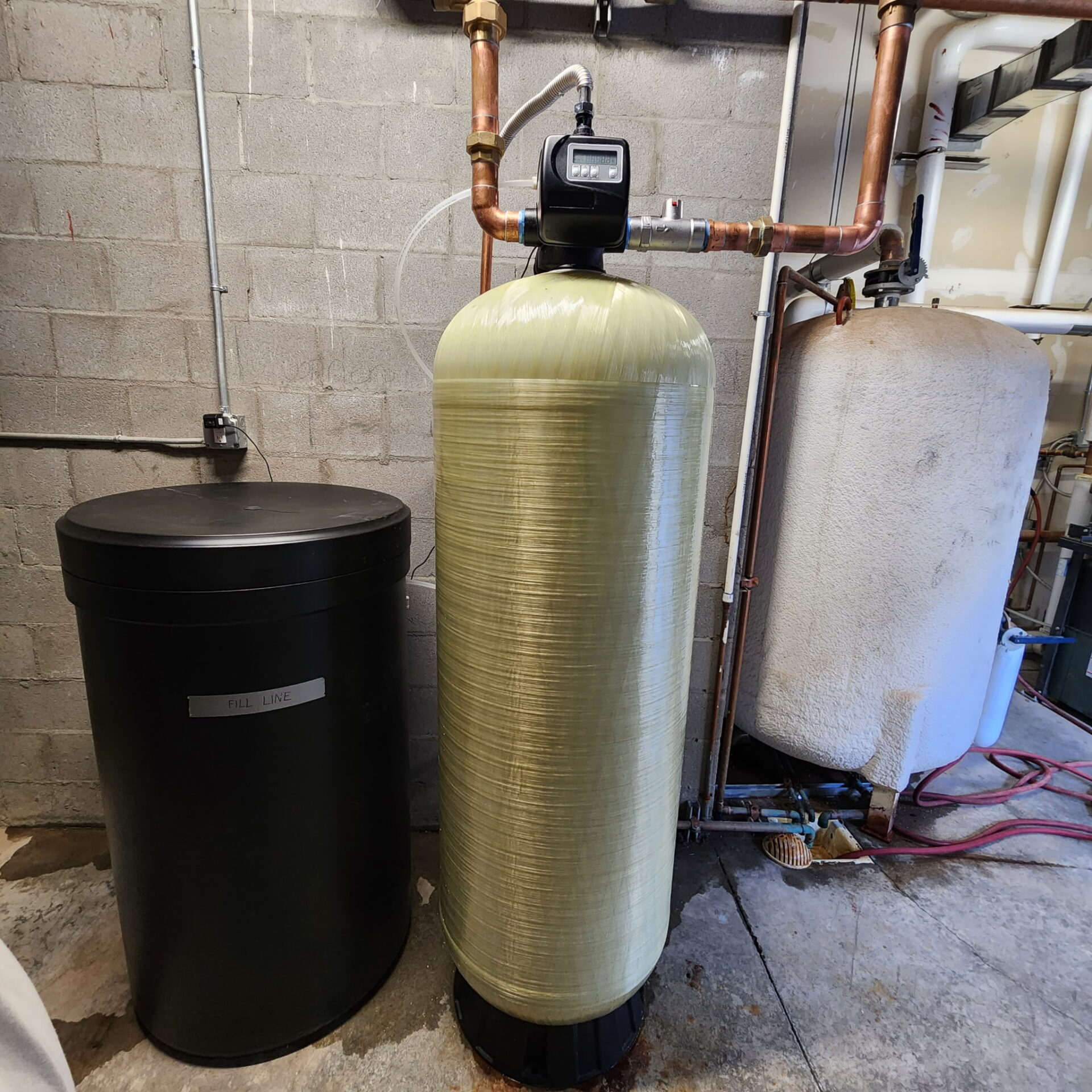 Commercial water softener system with brine tank