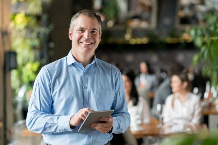 Phoenix restaurant owner smiling after switching to Smart Salt Delivery service