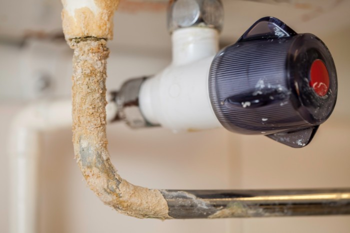 Limescale buildup inside a pipe caused by Phoenix hard water