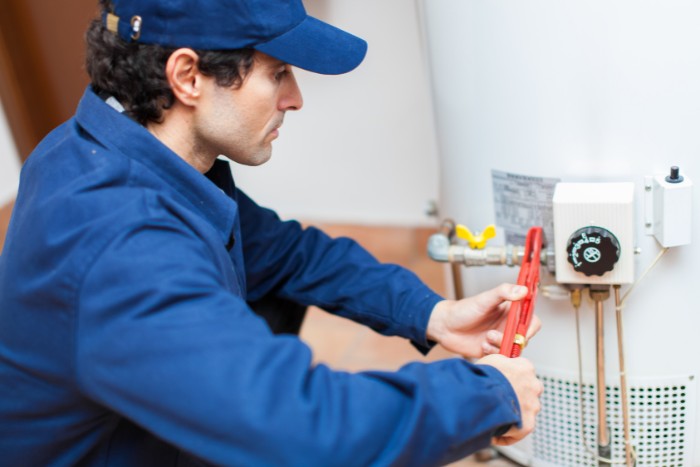 Professional water heater inspection for hard water scale buildup